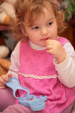 little girl with toy makeup
