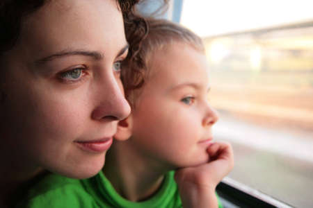 mother and son look in train`s windowの写真素材
