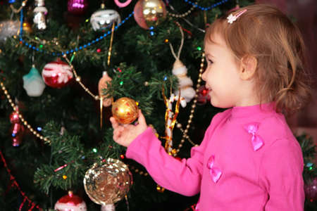 little girl and christmas firの写真素材