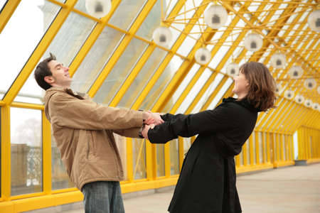 boy and girl hold each other for hands