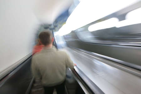 abstract escalator with passengers. blur motion