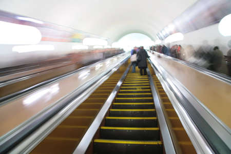 abstract passengers on escalator. motion blurの写真素材