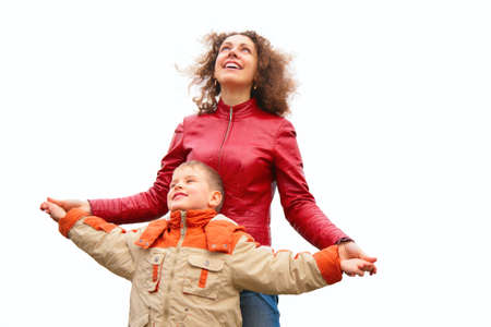 mother and son stand outdoor and look upの写真素材