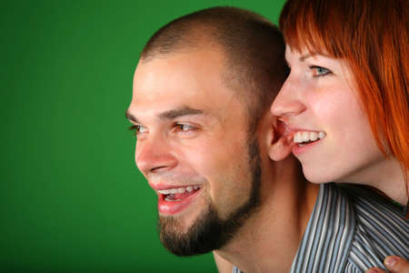 beard red couple smile faces on greenの写真素材