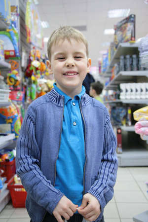 boy in toy section in shopの写真素材