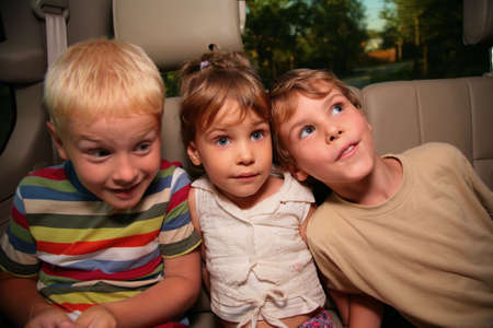 Three children in carの写真素材