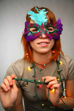 woman in mask with garlandの写真素材