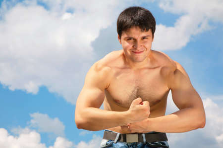 bodybuilder on skyの写真素材