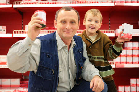 Grandfather and grandson in food shopの写真素材