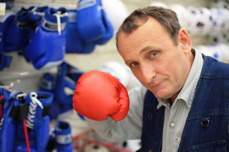 The man with a boxing glove in shopの写真素材