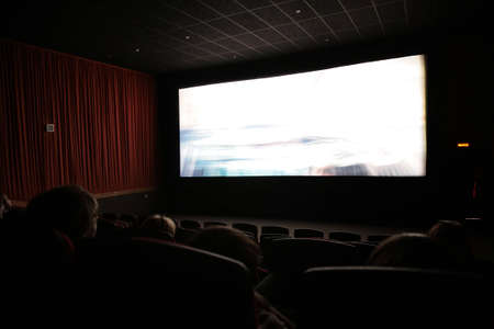 Viewers in cinema, focus on first chairs lineの写真素材