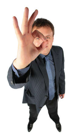 Man looks through a sign ok, focus on handの写真素材