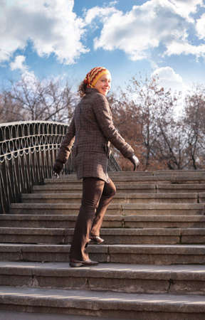 Beauty girl on stone ladderの写真素材