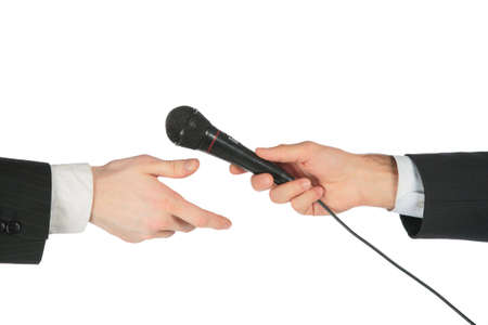 Hand takes microphone from another