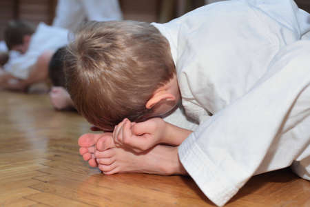 karate boy in sport hall makes exerciseの写真素材