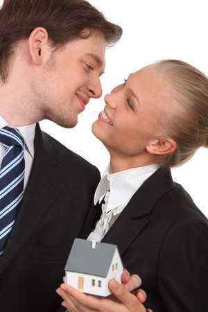 young couple isolated holding homeの写真素材