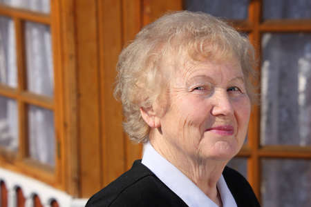 Portrait of aged woman outdoorの写真素材