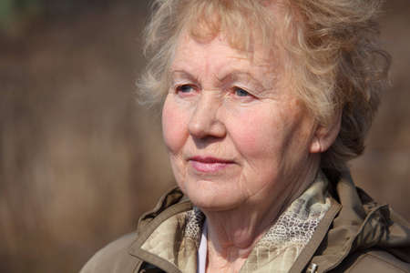 Aged woman face, spring outdoorの写真素材