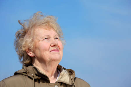 Smiling aged woman look in skyの写真素材