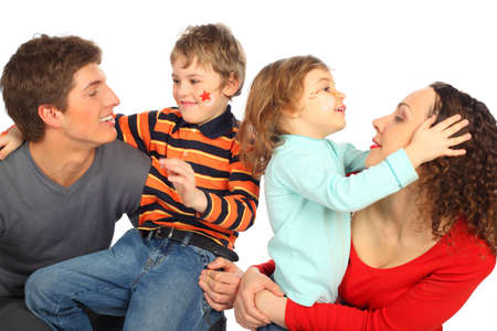 happy family of four with paintings on childish facesの写真素材