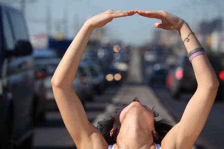 Close up  head of girl thrown back and hand  ring on  highway middle