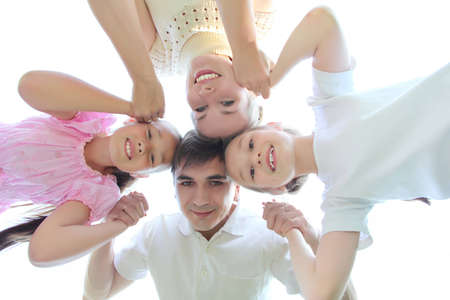 parents and children on sky, view from downの写真素材
