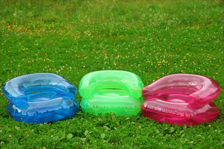 three RGB Inflatable armchairs on lawn