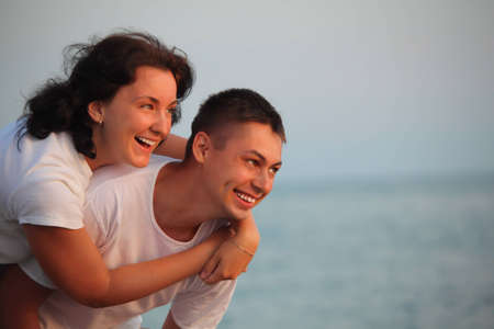 young pair embraces の写真素材