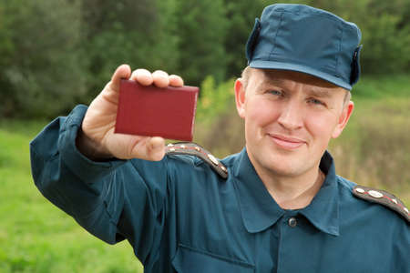 officer of rescue service showing his identity cardの写真素材