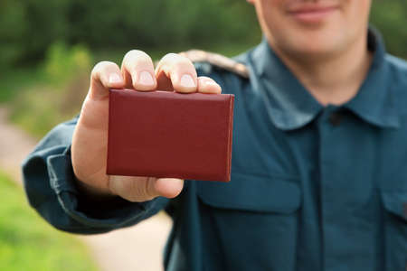 officer of rescue service showing his identity card