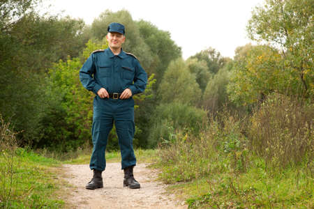 officer of rescue service standing on footpath outdoors