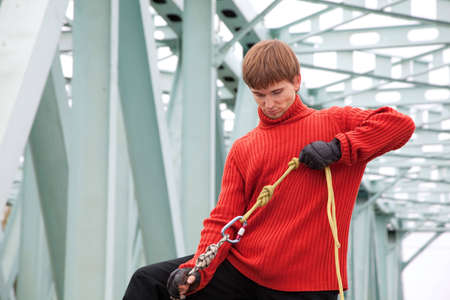man with equipment rope bridgeの写真素材
