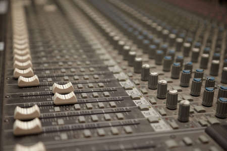 faders of dusty sound mixer. two faders in focusの写真素材