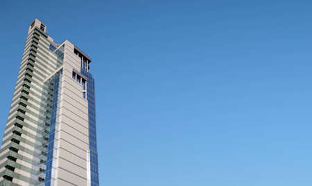 office building and panorama of clear blue sky