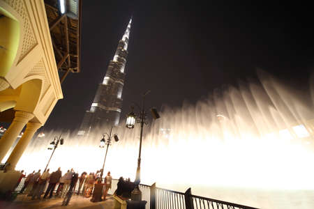 Burj Dubai skyscraper and fountain turned on night time general view, Dubai, United Arab Emiratesのeditorial素材