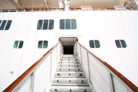 entrance with rails and stairs in large white passenger liner summer dayの写真素材