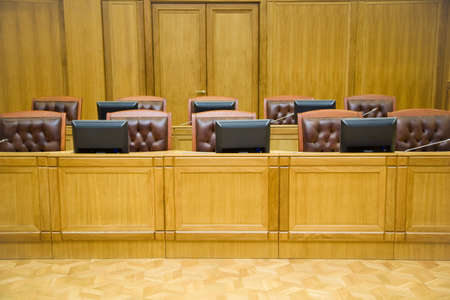 Conference halls with magnificent leather armchairs and wooden tables with microphones and monitors