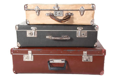 three old dirty dusty suitcases. all suitcases is closed. Isolated.