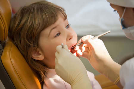 young girl have periodic survey tooth in medical office