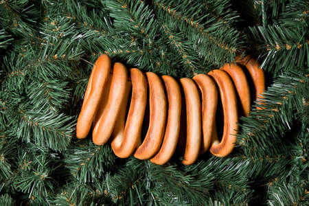Sheaf of bagels hanging on Christmas fur-tree, ten bagelsの写真素材