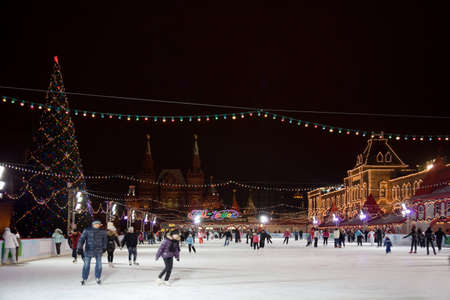 skating-rink on red square in moscow at night. GUM trading house. Forshortening with side