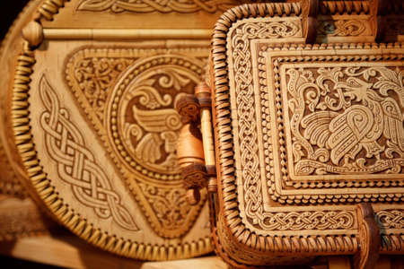 Beautiful boxes made of birch bark with  carved pattern. Russian national crafts. Focus on the lid.