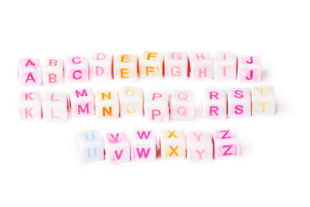 English alphabet on white cubes with bright letters