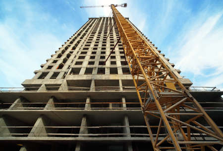 MOSCOW - SEPTEMBER 27: Tall building under construction with crane in Losiny Island residential...
