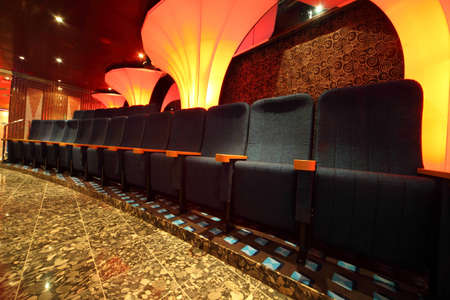 illuminated hall inside of ship. row of comfortable seats. wide angle.のeditorial素材