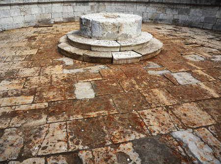 Inside stone drained fountain, which sprinkled with coins on place of execution of Red square in Moscow, Russiaのeditorial素材