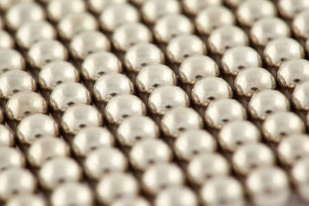 Silvery beads are interlaced together