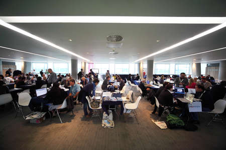 DUBLIN - JUNE 10: People sitting at the discussion tables in the meeting hall on CEPIC Congress 2010 on June 10, 2010 in Dublin. CEPIC â is a center of Picture Industryのeditorial素材