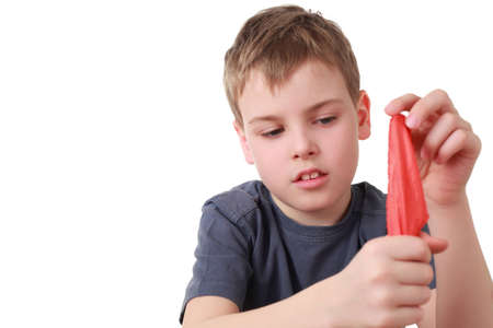 Boy hides  shawl in fist is focusの写真素材
