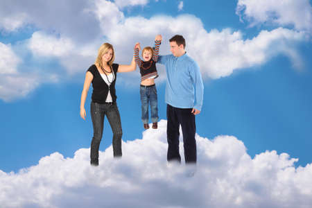 family with haging boy on cloud sky collageの写真素材